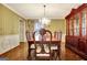 Elegant dining room with wood floors, traditional furnishings, and a decorative chandelier at 550 Hawthorne Dr, Fayetteville, GA 30214