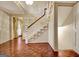 Foyer featuring hardwood floors, stairs, and a view into the living room at 550 Hawthorne Dr, Fayetteville, GA 30214