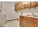 Functional laundry room features overhead cabinets, sink and ample counter space at 550 Hawthorne Dr, Fayetteville, GA 30214