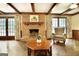 Bright living room features hardwood floors, a fireplace, and cozy seating at 550 Hawthorne Dr, Fayetteville, GA 30214