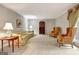 Spacious living room with neutral carpet, a large window, and classic furnishings at 550 Hawthorne Dr, Fayetteville, GA 30214