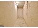 Narrow storage room with textured walls and basic lighting, providing a utilitarian space for organization at 550 Hawthorne Dr, Fayetteville, GA 30214