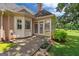 This backyard features a patio, garden, and well-manicured lawn at 10 Wigwam Cir, Whitesburg, GA 30185