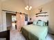 Comfortable bedroom offering a relaxing retreat with views into an adjacent room at 10 Wigwam Cir, Whitesburg, GA 30185