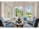 Bright breakfast nook with large windows and a cozy built-in bench at 10 Wigwam Cir, Whitesburg, GA 30185