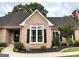 Charming single-story brick home featuring a landscaped yard and classic architectural details at 10 Wigwam Cir, Whitesburg, GA 30185
