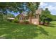Brick home exterior with a sunroom and a covered patio at 10 Wigwam Cir, Whitesburg, GA 30185