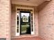Inviting front entry with a stylish door and decorative 'Welcome' sign, adding charm and curb appeal to the home's facade at 10 Wigwam Cir, Whitesburg, GA 30185