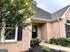 Welcoming front entrance showcases brick facade, black shutters, and landscaped walkway at 10 Wigwam Cir, Whitesburg, GA 30185