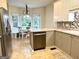 Eat-in kitchen with stainless appliances, tile backsplash, and a cozy breakfast nook with built-in bench at 10 Wigwam Cir, Whitesburg, GA 30185