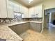 Well-appointed kitchen with modern appliances, ample counter space, and stylish backsplash at 10 Wigwam Cir, Whitesburg, GA 30185
