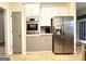 Well-equipped kitchen featuring stainless steel appliances, stylish cabinets, and modern design at 10 Wigwam Cir, Whitesburg, GA 30185