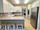 Kitchen features granite countertops, stainless steel appliances, and white and gray cabinetry at 10 Wigwam Cir, Whitesburg, GA 30185
