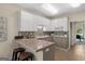 This kitchen features stainless steel appliances and updated cabinets at 10 Wigwam Cir, Whitesburg, GA 30185