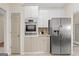 This kitchen features stainless steel appliances and updated cabinets at 10 Wigwam Cir, Whitesburg, GA 30185