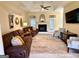 Spacious living room with a fireplace, high ceiling, and comfortable seating at 10 Wigwam Cir, Whitesburg, GA 30185
