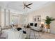 Bright living room with high ceilings, decorative columns, and stylish furnishings at 10 Wigwam Cir, Whitesburg, GA 30185