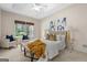 This primary bedroom features a trey ceiling, sitting area, and a king-sized bed at 10 Wigwam Cir, Whitesburg, GA 30185