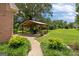 Covered outdoor patio with dining set, perfect for entertaining at 10 Wigwam Cir, Whitesburg, GA 30185