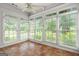 Bright sunroom with tile floors and large windows providing abundant natural light and scenic views at 10 Wigwam Cir, Whitesburg, GA 30185