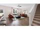 Spacious living room boasting hardwood floors, bright, natural light and neutral color palette at 351 Friendship Oak Way, Hampton, GA 30228