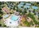 Aerial view of community amenities featuring a pool, playground, tennis courts, and recreation center at 372 Cobblestone Trl, Dallas, GA 30157