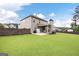 Beautiful backyard with a well-maintained lawn, a patio, and a view of the home's exterior at 372 Cobblestone Trl, Dallas, GA 30157