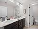 Bathroom featuring double sink vanity with a large decorative mirror at 372 Cobblestone Trl, Dallas, GA 30157