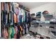 Walk-in closet featuring clothing racks and shelving with shoes and folded clothes at 372 Cobblestone Trl, Dallas, GA 30157
