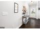 Bright foyer with hardwood floors, stylish decor, and a view of the front door, creating an inviting entrance at 372 Cobblestone Trl, Dallas, GA 30157