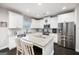 Open kitchen with white cabinets, granite countertops, and stainless steel appliances at 372 Cobblestone Trl, Dallas, GA 30157