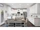 Bright kitchen with white cabinetry, stainless steel appliances, and dark wood flooring at 372 Cobblestone Trl, Dallas, GA 30157
