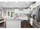 Bright, open kitchen featuring a large island and stainless steel appliances at 372 Cobblestone Trl, Dallas, GA 30157