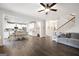 Open-concept living space showcases wood floors, white kitchen, and an inviting atmosphere at 372 Cobblestone Trl, Dallas, GA 30157