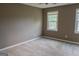 Spacious bedroom with neutral walls, soft carpet, and plenty of natural light at 2763 Hunters Ct, Hampton, GA 30228