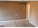 Empty bedroom with neutral walls, carpeted floor, and white trim at 2763 Hunters Ct, Hampton, GA 30228