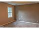 Bright bedroom featuring neutral walls, plush carpeting, and a large window at 2763 Hunters Ct, Hampton, GA 30228