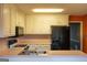 Kitchen features white cabinetry, stainless steel appliances, and light countertops at 2763 Hunters Ct, Hampton, GA 30228