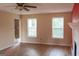 Spacious living room with wood flooring, fireplace, and ample natural light at 2763 Hunters Ct, Hampton, GA 30228