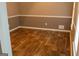 Cozy living room featuring neutral walls and wood-look flooring at 2763 Hunters Ct, Hampton, GA 30228