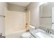 Bathroom featuring shower-tub combo and granite countertop at 8330 N Sterling Lakes Dr, Covington, GA 30014