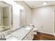 Bathroom with granite countertops and dual sinks at 8330 N Sterling Lakes Dr, Covington, GA 30014