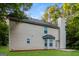 Backyard exterior view of a two story home with vinyl siding and chimney at 8330 N Sterling Lakes Dr, Covington, GA 30014