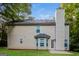 Backyard exterior view of a two story home with vinyl siding and chimney at 8330 N Sterling Lakes Dr, Covington, GA 30014