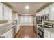 Bright kitchen featuring granite countertops and stainless steel appliances at 8330 N Sterling Lakes Dr, Covington, GA 30014