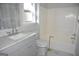 Bathroom features vanity, toilet, mirror and bath at 3700 Newhalem Sw St, Atlanta, GA 30331