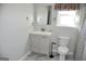 Bright bathroom features a vanity sink, mirror, toilet, and shower at 3700 Newhalem Sw St, Atlanta, GA 30331