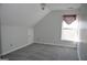 Well-lit room featuring a window, carpeted floor, and a storage area at 3700 Newhalem Sw St, Atlanta, GA 30331