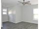 Bright bedroom featuring durable laminate floors, ceiling fan, and neutral colored walls at 3700 Newhalem Sw St, Atlanta, GA 30331
