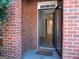 Brick exterior showing the front door and a glimpse of the light-filled foyer at 3700 Newhalem Sw St, Atlanta, GA 30331